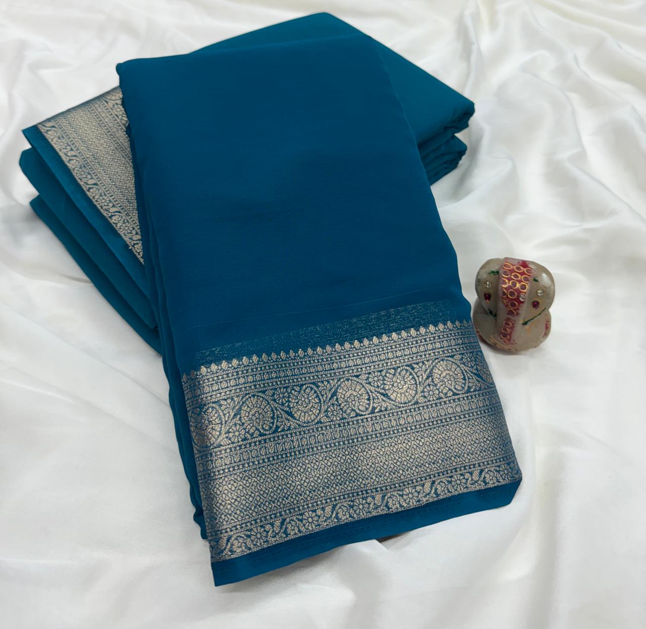Peacock Blue Pure Khadi Georgette Saree with Silver Contrast Border